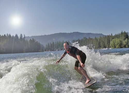Dr. Tom Zolezzi of Chiropractic Works Wellness Center in Spokane Valley WA is surfing.